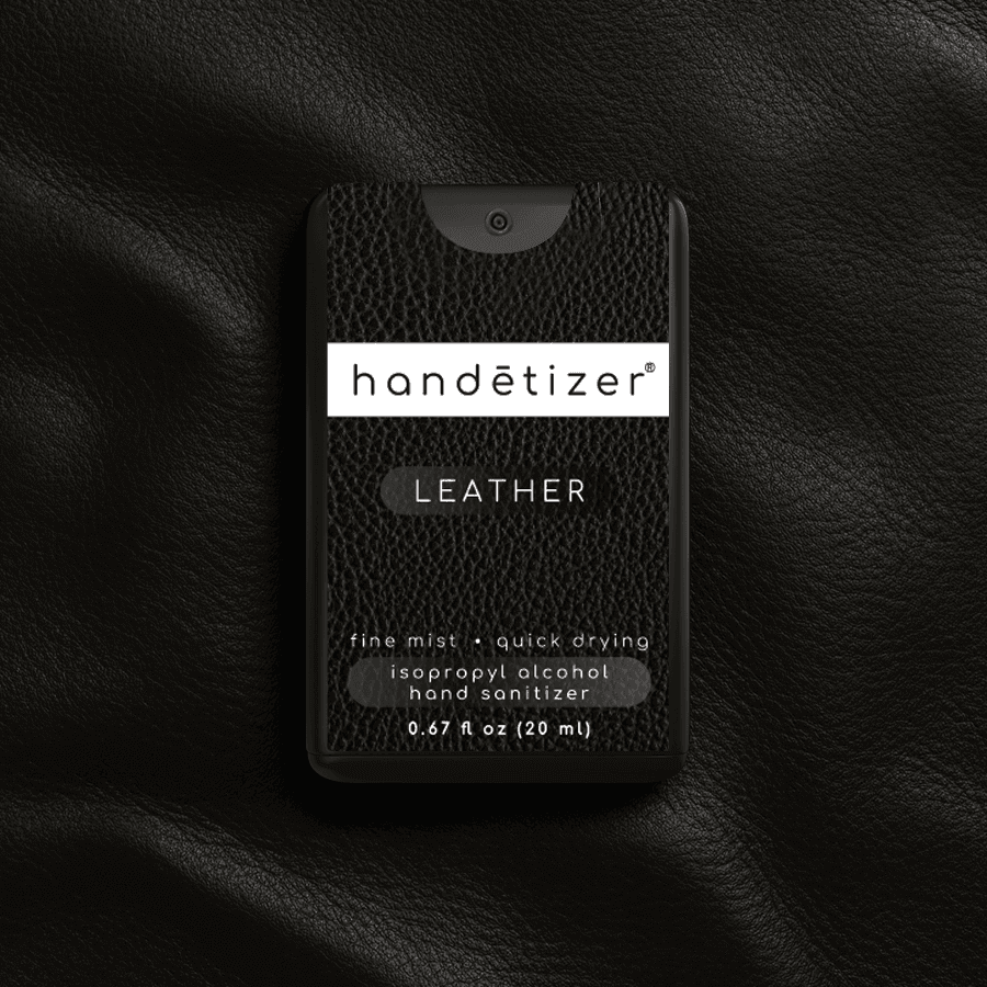 Front facing view of the Leather hand sanitizer spray with a leather background