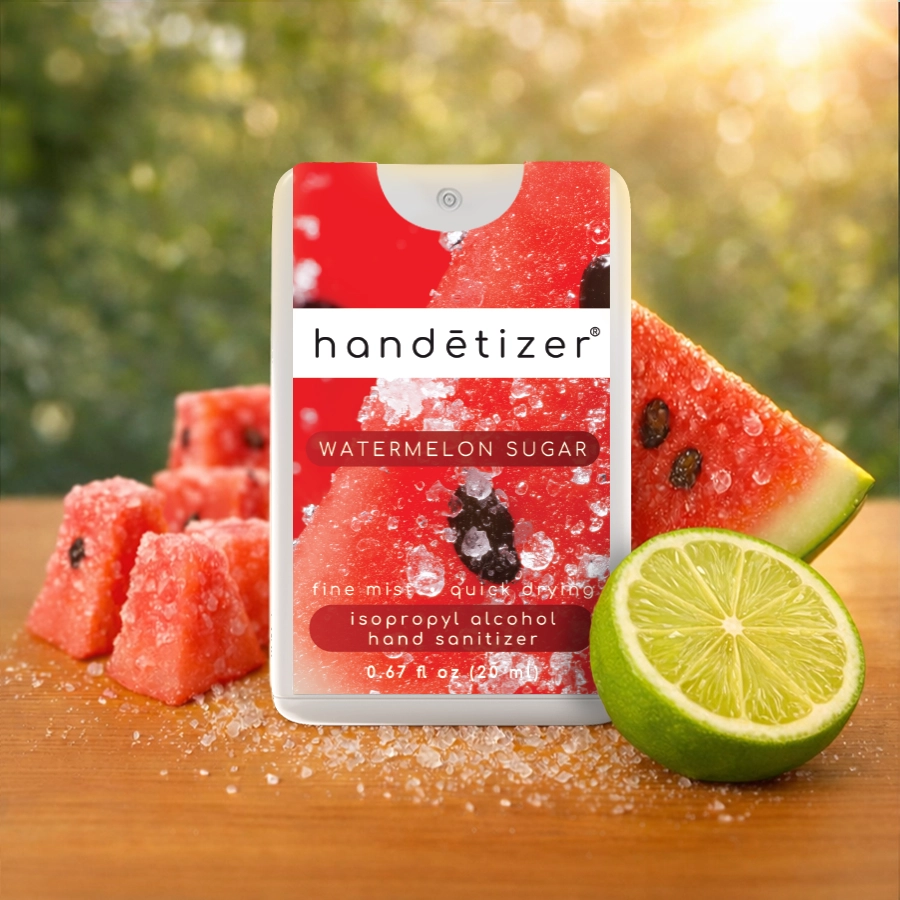 Front facing view of the Watermelon Sugar hand sanitizer spray with watermelon and lime in the background